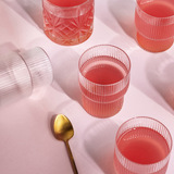 Essa World Collagen poured in multiple glasses.