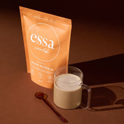 Essa World Vegan Protein Powder in Salted Caramel flavour poured in a cup.
